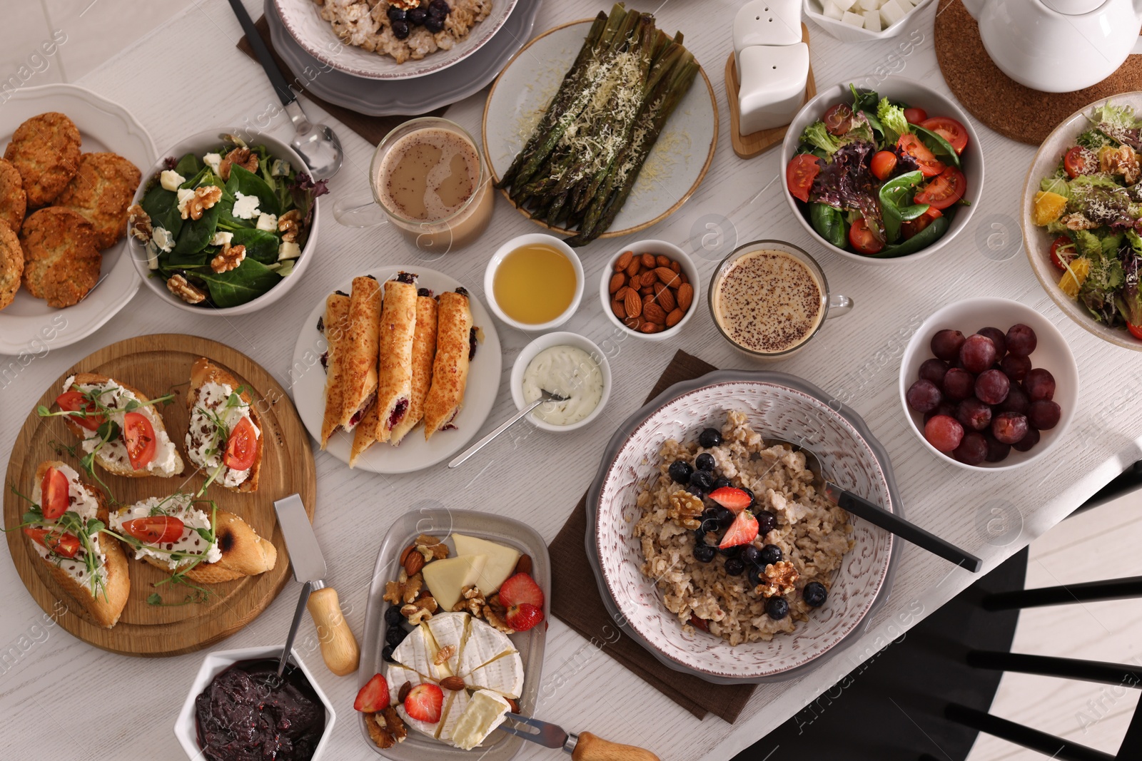 Photo of Many different dishes served on buffet table for brunch, flat lay