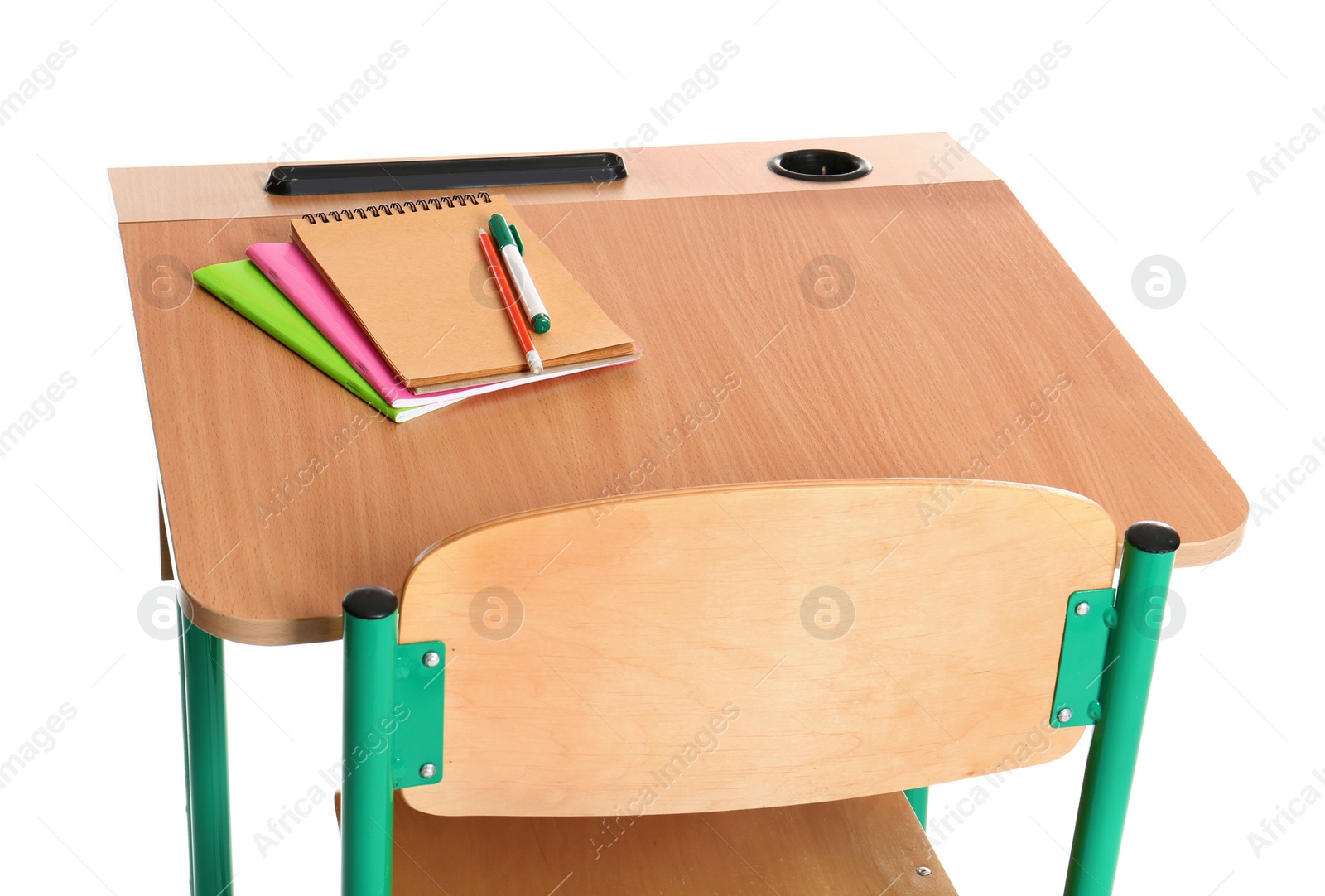 Photo of Wooden school desk with stationery on white background