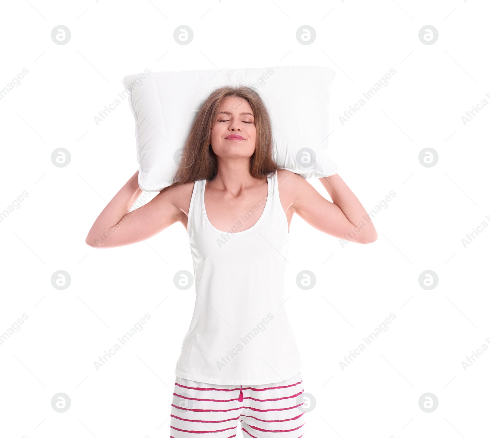 Photo of Happy woman in pajamas with pillow on white background