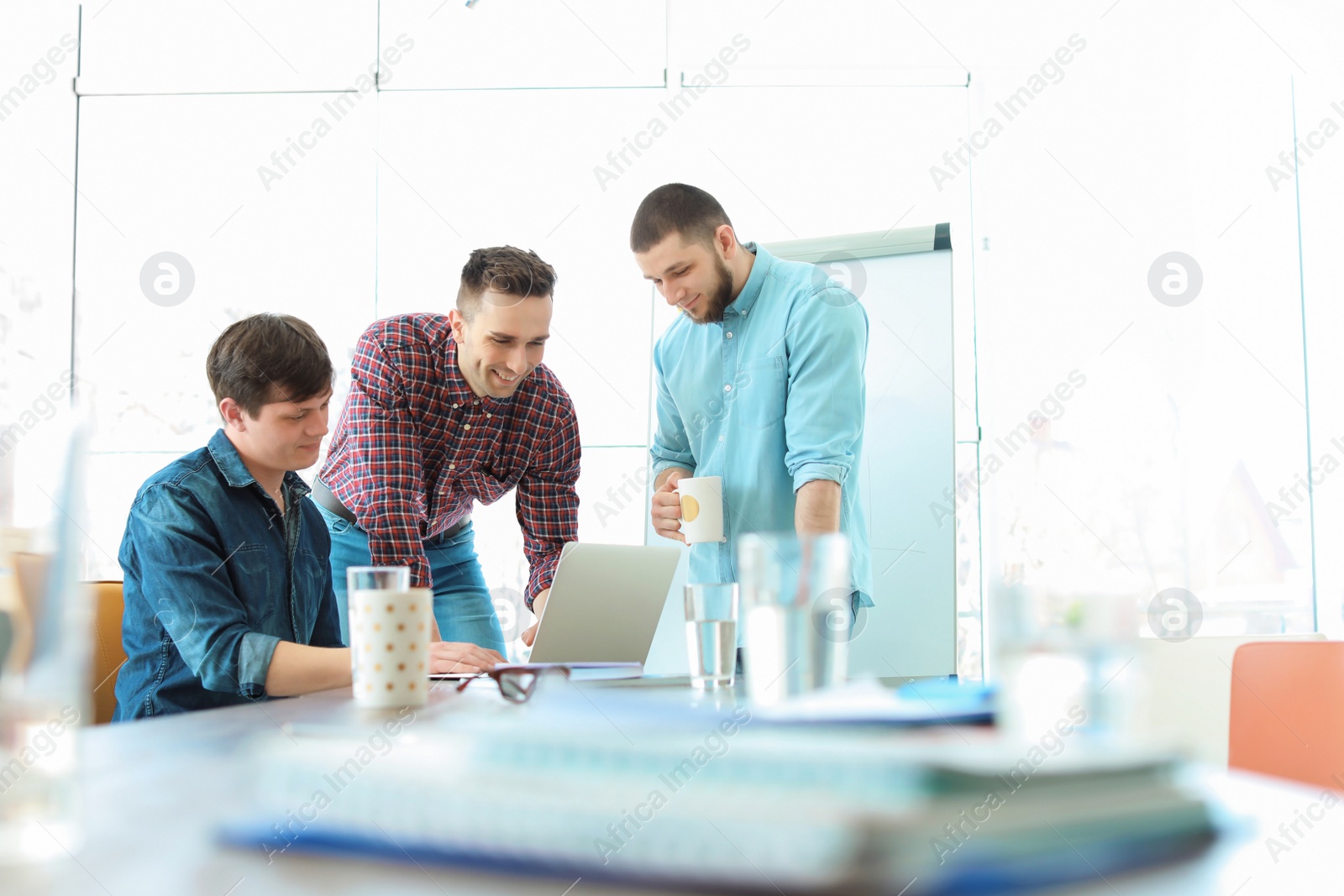 Photo of Young people having business training in office