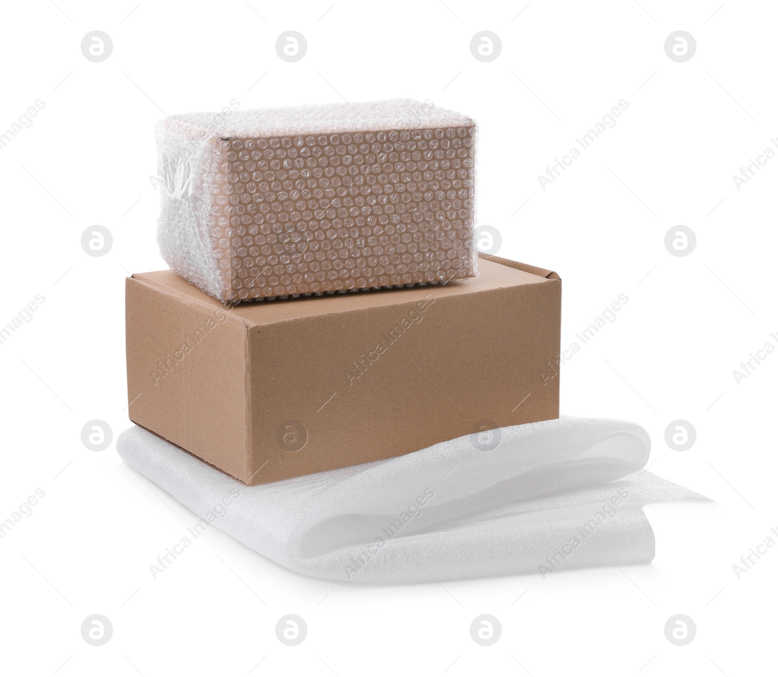 Photo of Cardboard boxes with bubble wrap and packaging foam on white background