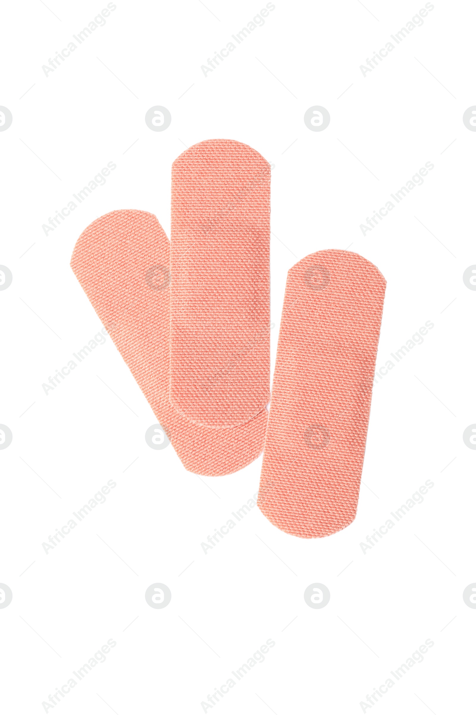Medical sticking plasters isolated on white. First aid item Photo of Medical sticking plasters isolated on white. First aid item