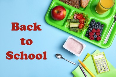 Serving tray of healthy food and stationery on turquoise background, flat lay. School lunch