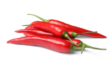 Ripe red hot chili peppers on white background