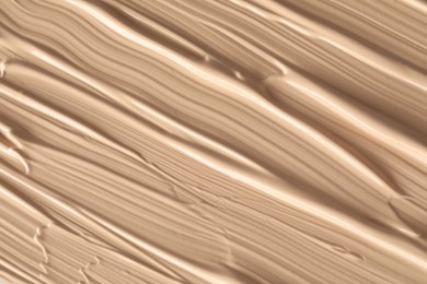 Photo of Texture of liquid skin foundation as background, closeup