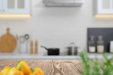 Image of Wooden table in light kitchen. Space for design