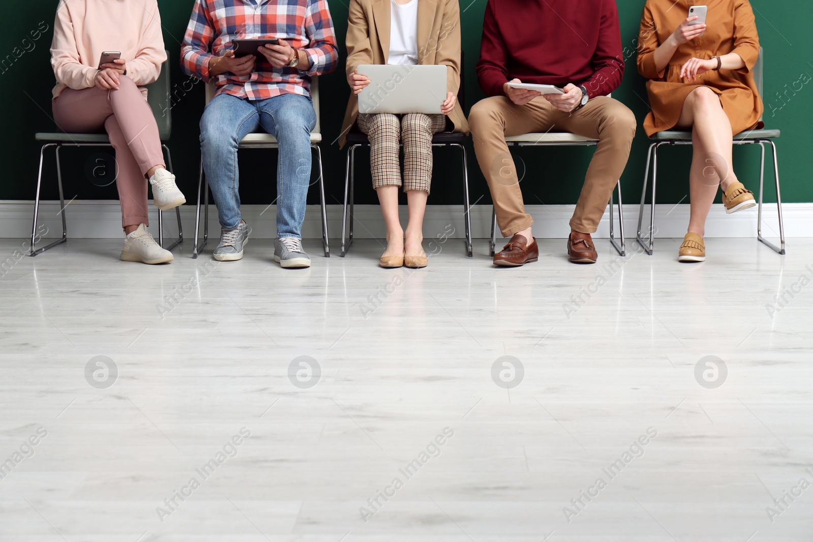 Photo of People waiting for job interview indoors, closeup