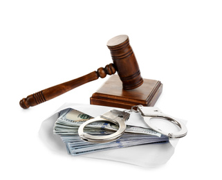Photo of Dollar bills in envelope, handcuffs and gavel isolated on white. Bribe concept