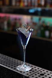 Photo of Fresh alcoholic cocktail in glass on bar counter