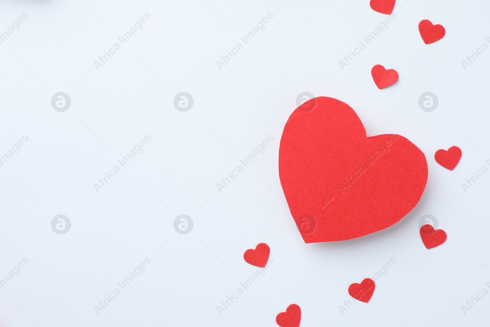 Photo of Paper hearts on white background, flat lay. Space for text