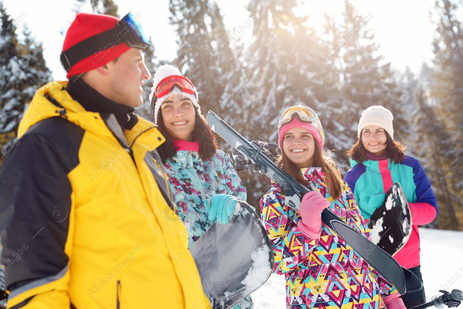 Photo of Group of friends with equipment in snowy mountains. Winter vacation