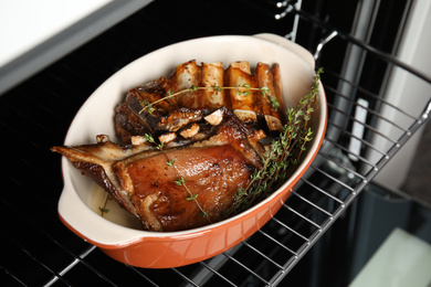 Delicious roasted ribs with thyme in oven