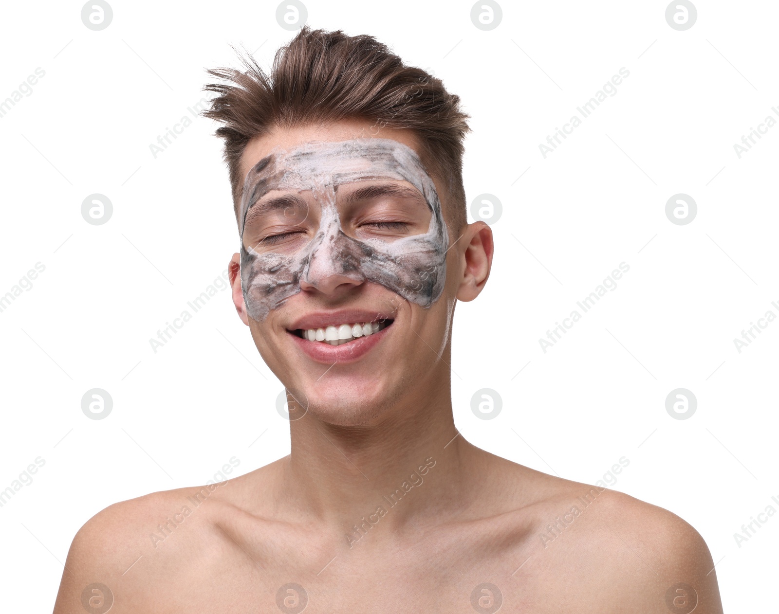 Photo of Handsome man with clay mask on his face against white background