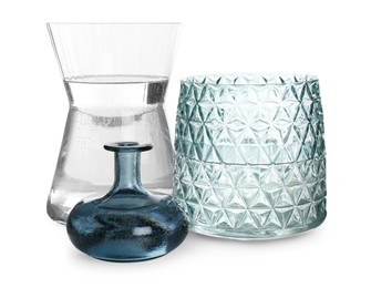 Different beautiful glass vases on white background