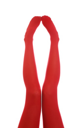 Woman wearing red tights on white background, closeup of legs