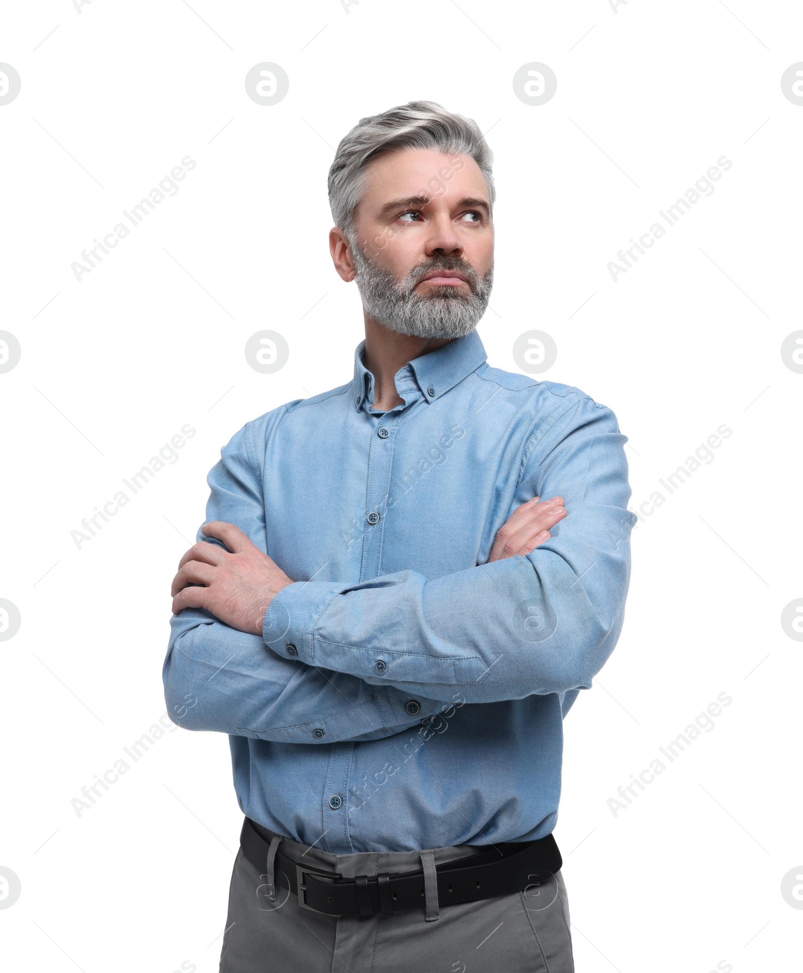 Photo of Mature businessman in stylish clothes posing on white background, low angle view