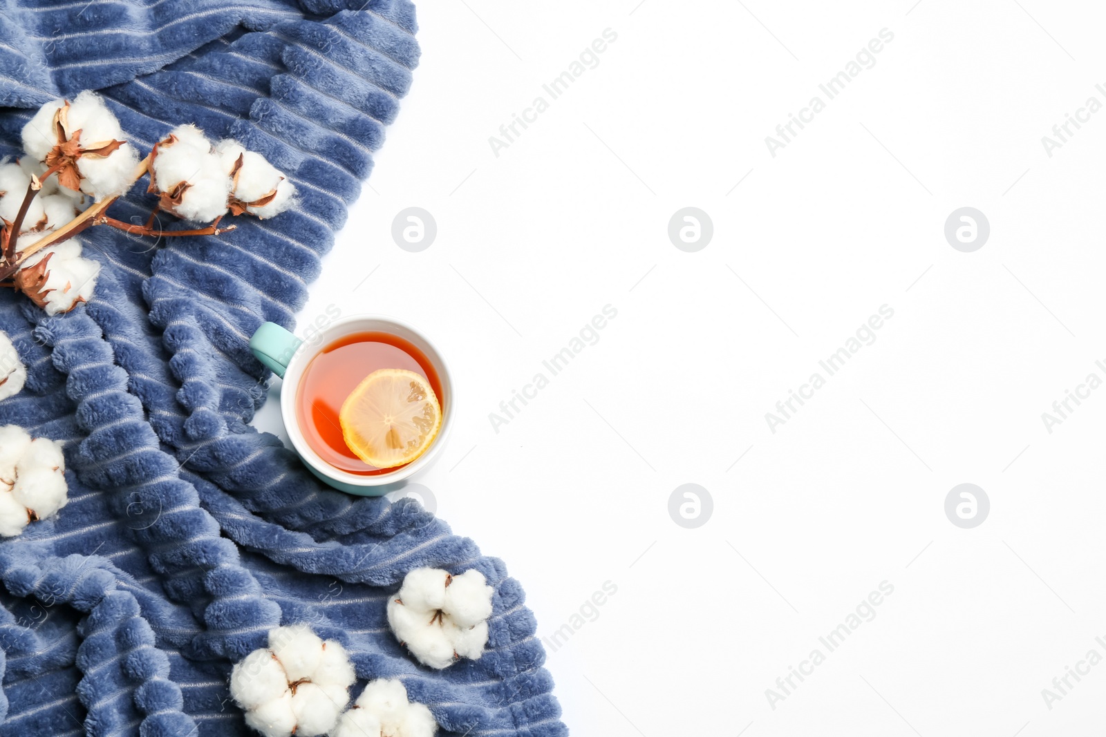 Photo of Flat lay composition with tea and warm plaid on white background, space for text