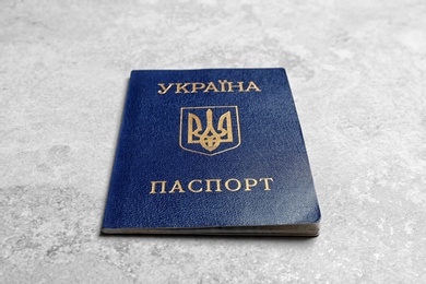 Photo of Ukrainian internal passport on grey background, closeup