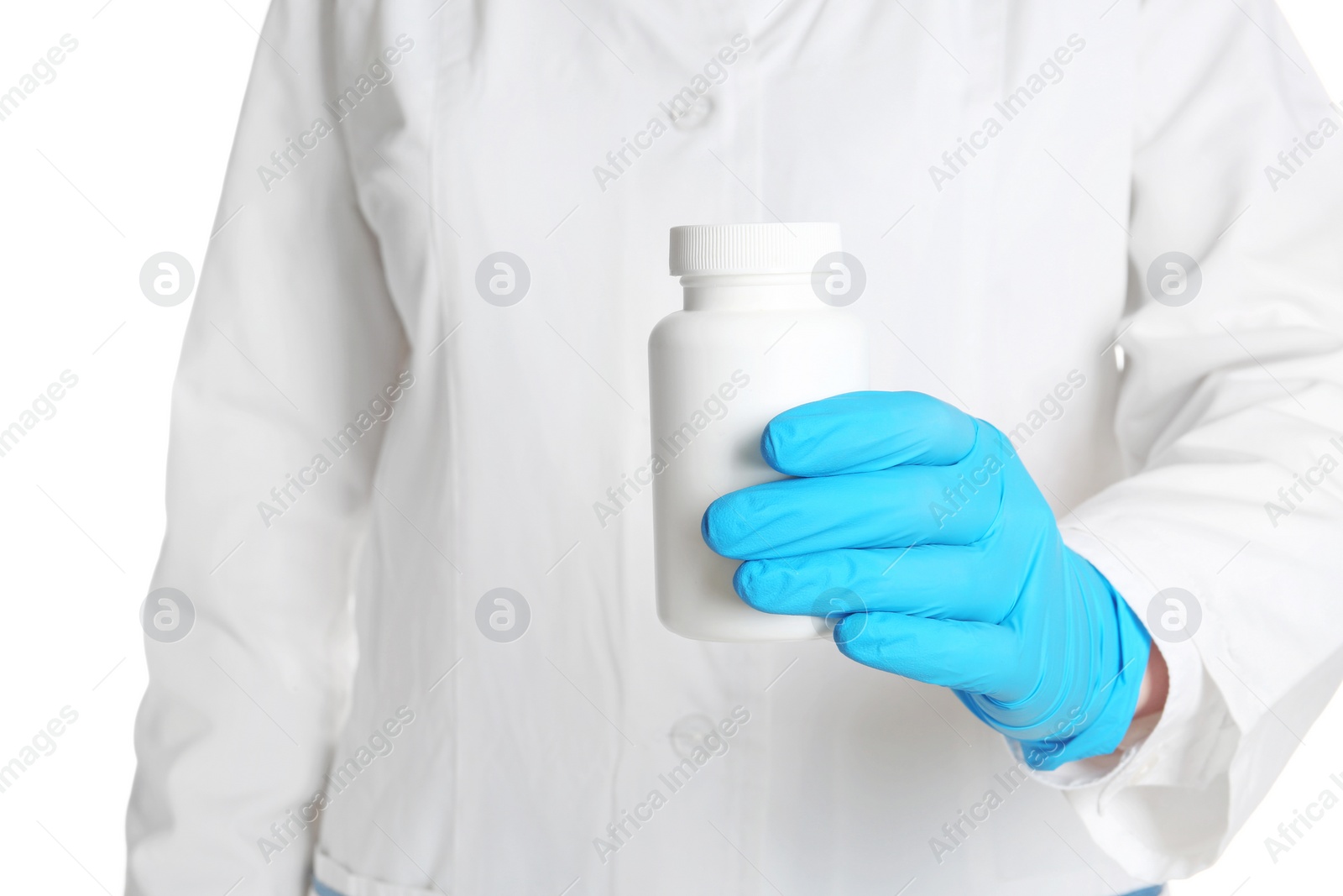 Photo of Doctor in medical glove holding bottle of pills on white background