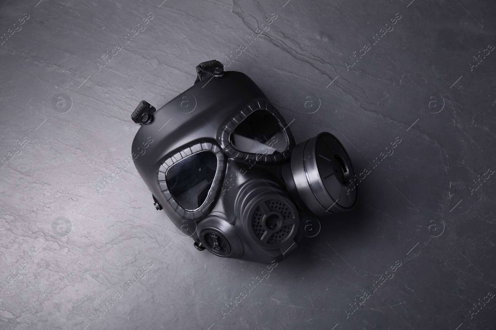 Photo of One gas mask on grey textured background, top view