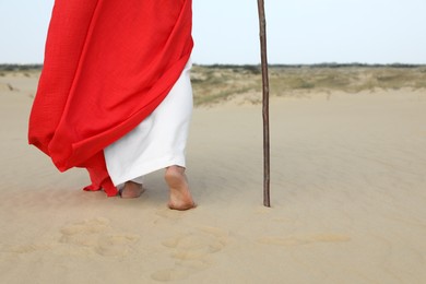 Photo of Jesus Christ walking in desert, closeup view