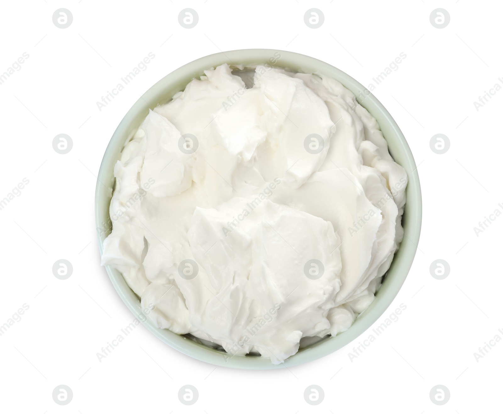 Photo of Bowl of tasty cream cheese isolated on white, top view