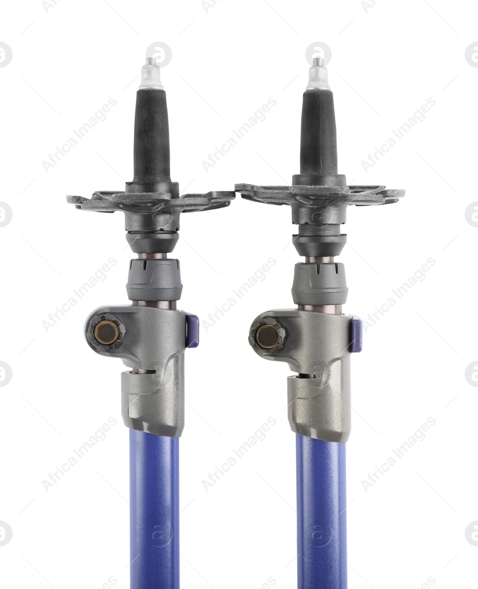 Photo of Pair of trekking poles on white background, top view. Camping tourism