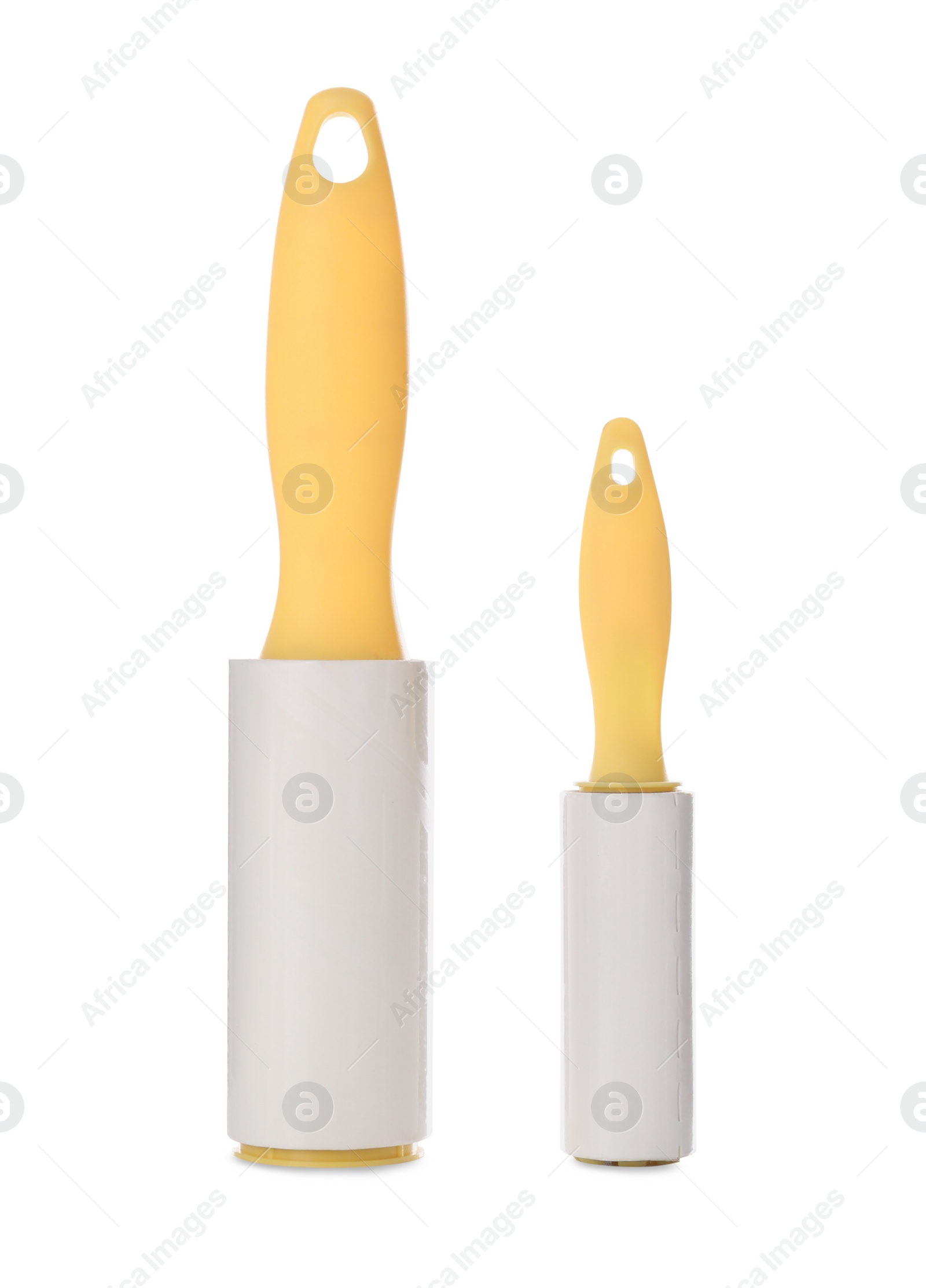 Photo of Different lint rollers with yellow handles isolated on white