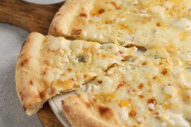 Photo of Delicious cheese pizza on light grey table, closeup