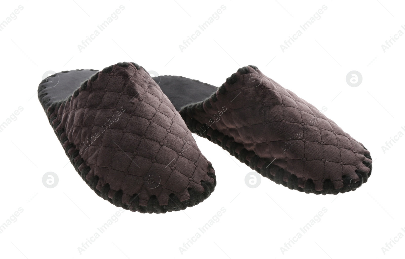 Photo of Pair of soft closed toe slippers on white background