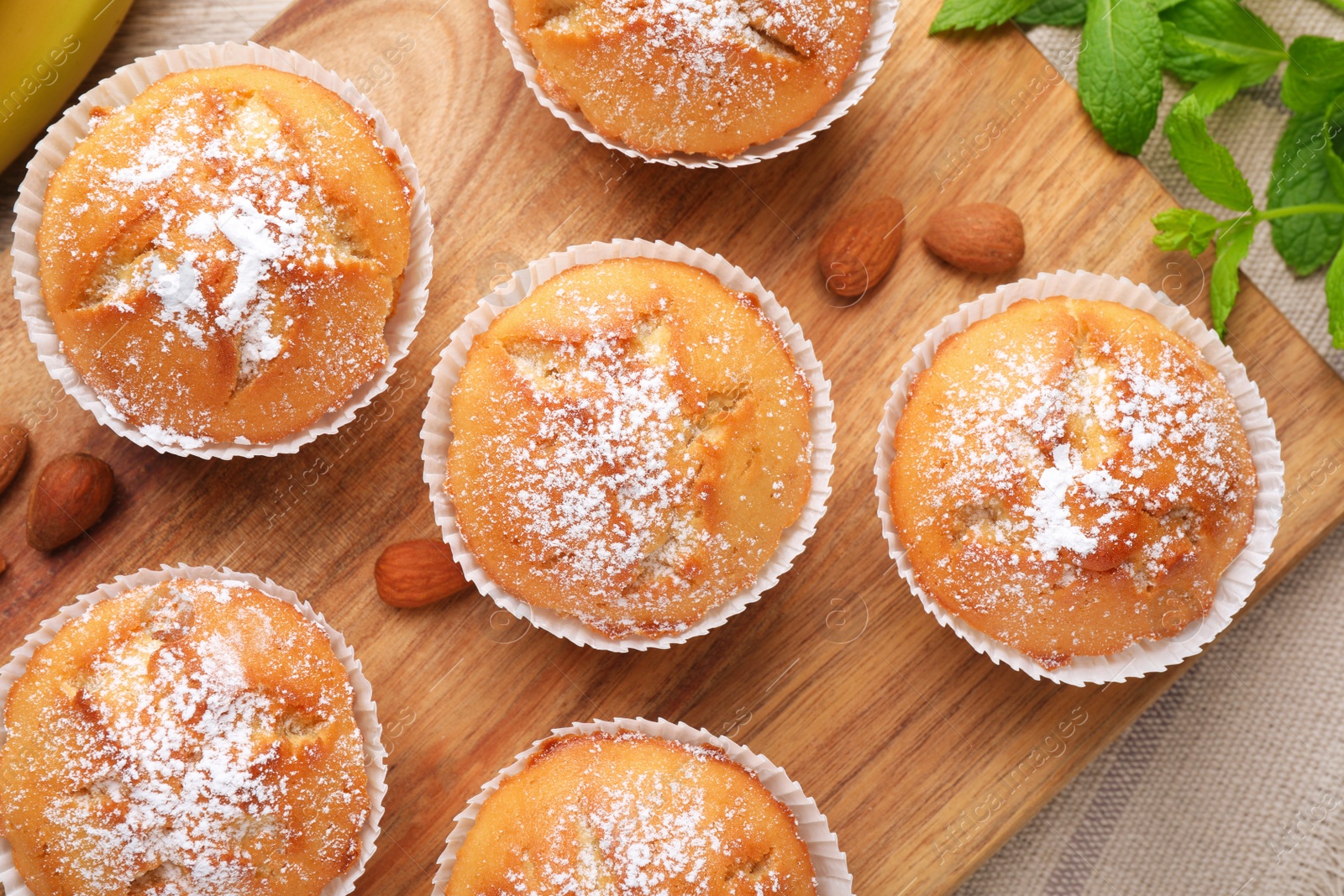 Photo of Flat lay composition with tasty muffins on table