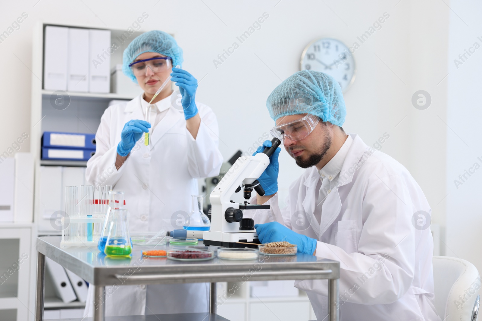 Photo of Quality control. Food inspectors checking safety of products in laboratory