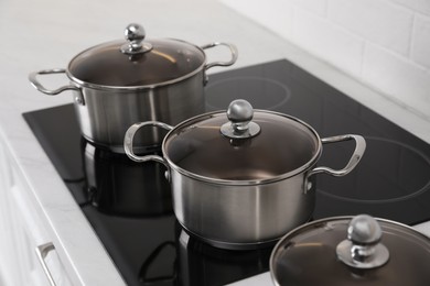 Photo of Set of new clean cookware in kitchen