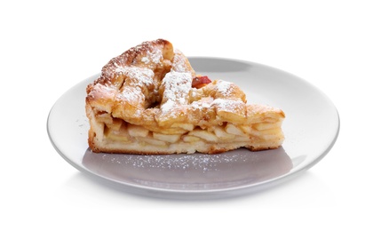 Photo of Slice of traditional apple pie with sugar powder on white