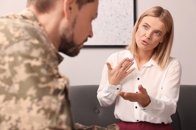 Psychologist working with military officer in office