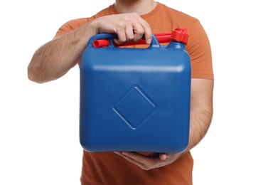 Man holding blue canister on white background, closeup