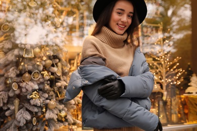 Photo of Young woman wearing stylish clothes outdoors, space for text. Autumn look