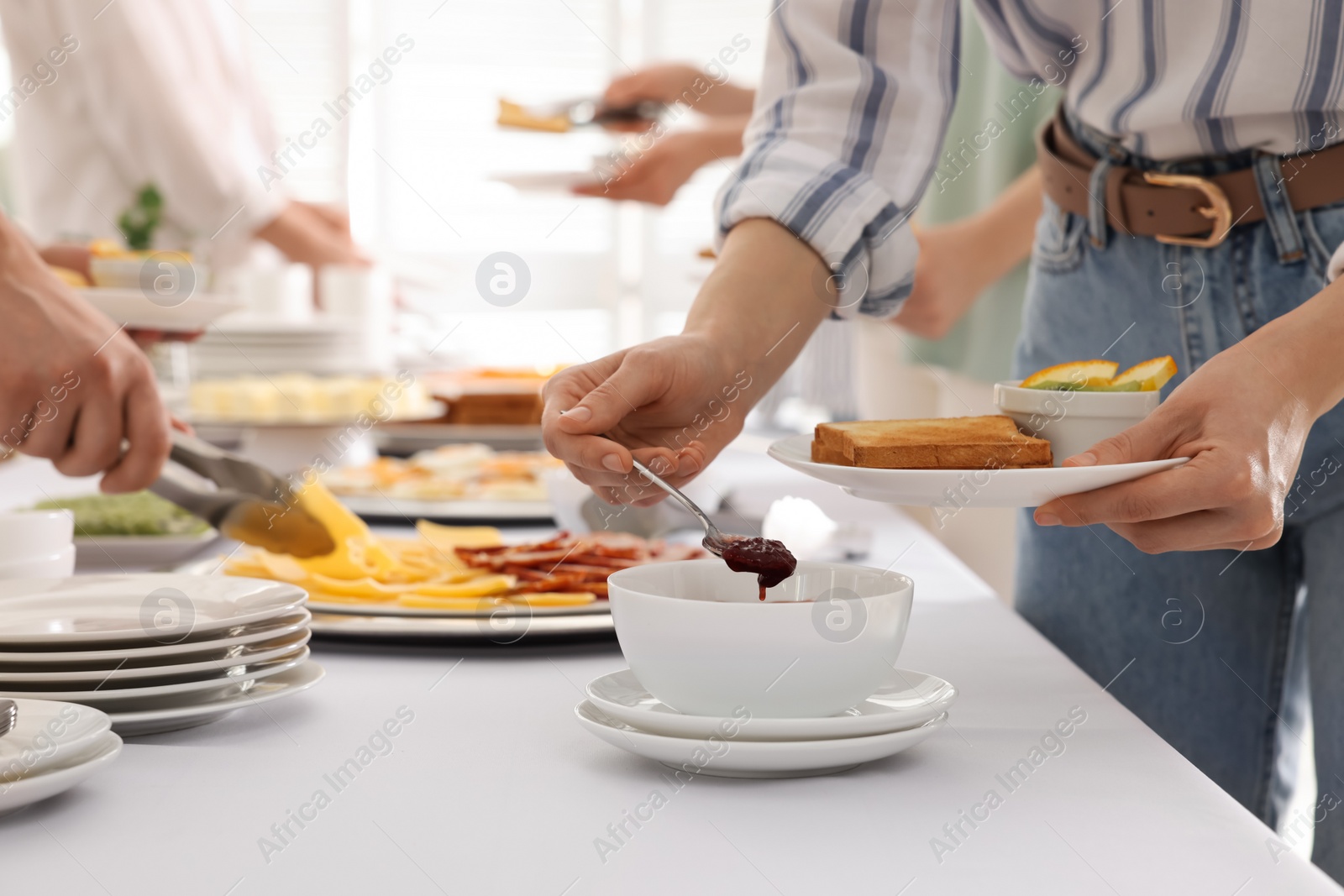 Photo of People near table with different dishes during breakfast, closeup. Buffet service