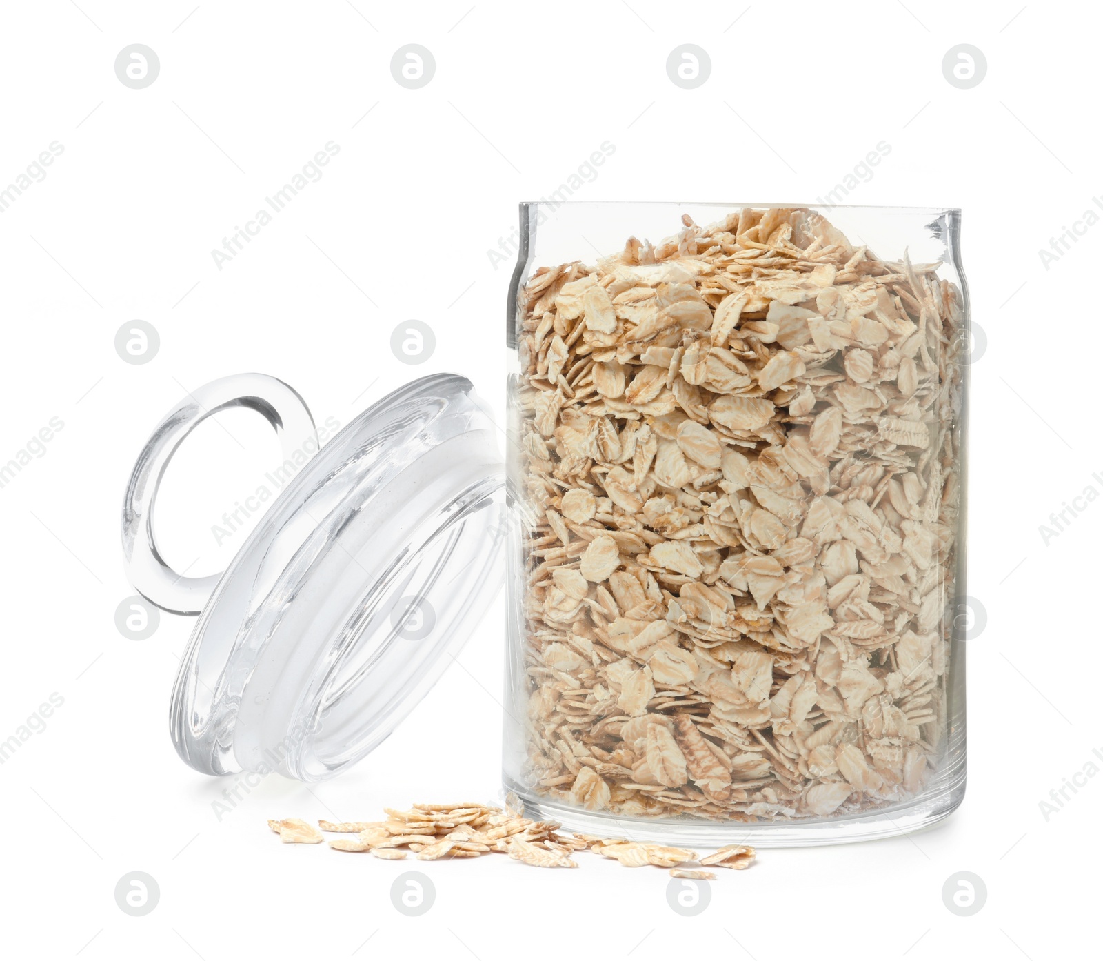 Photo of Raw oatmeal and glass jar on white background