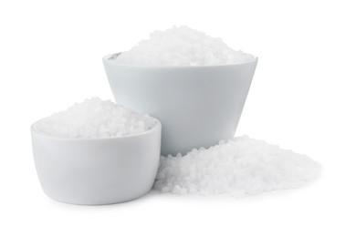 Ceramic bowls with natural sea salt isolated on white