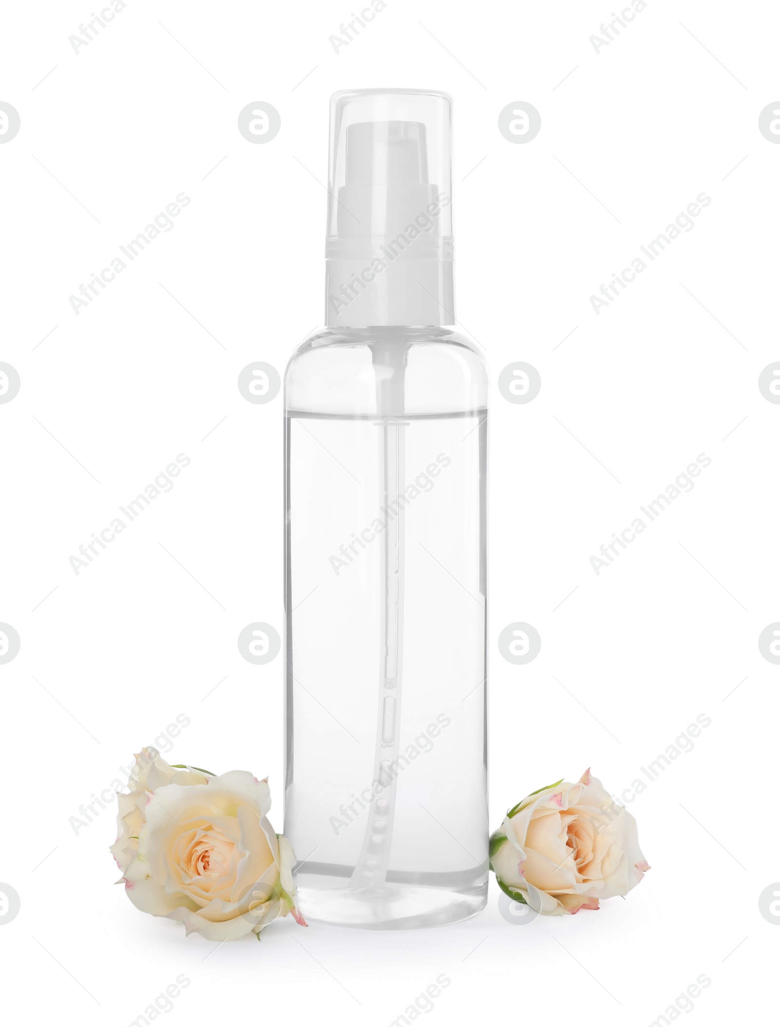 Photo of Bottle of micellar cleansing water and flowers on white background