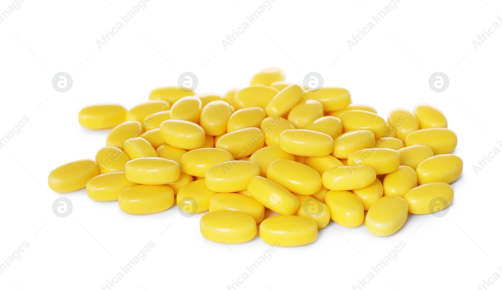 Photo of Tasty yellow dragee candies on white background