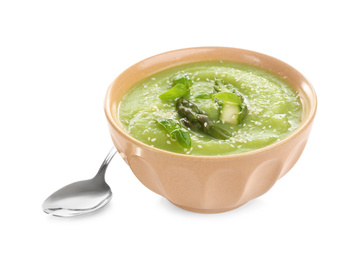 Delicious asparagus soup with basil and sesame  seeds isolated on white