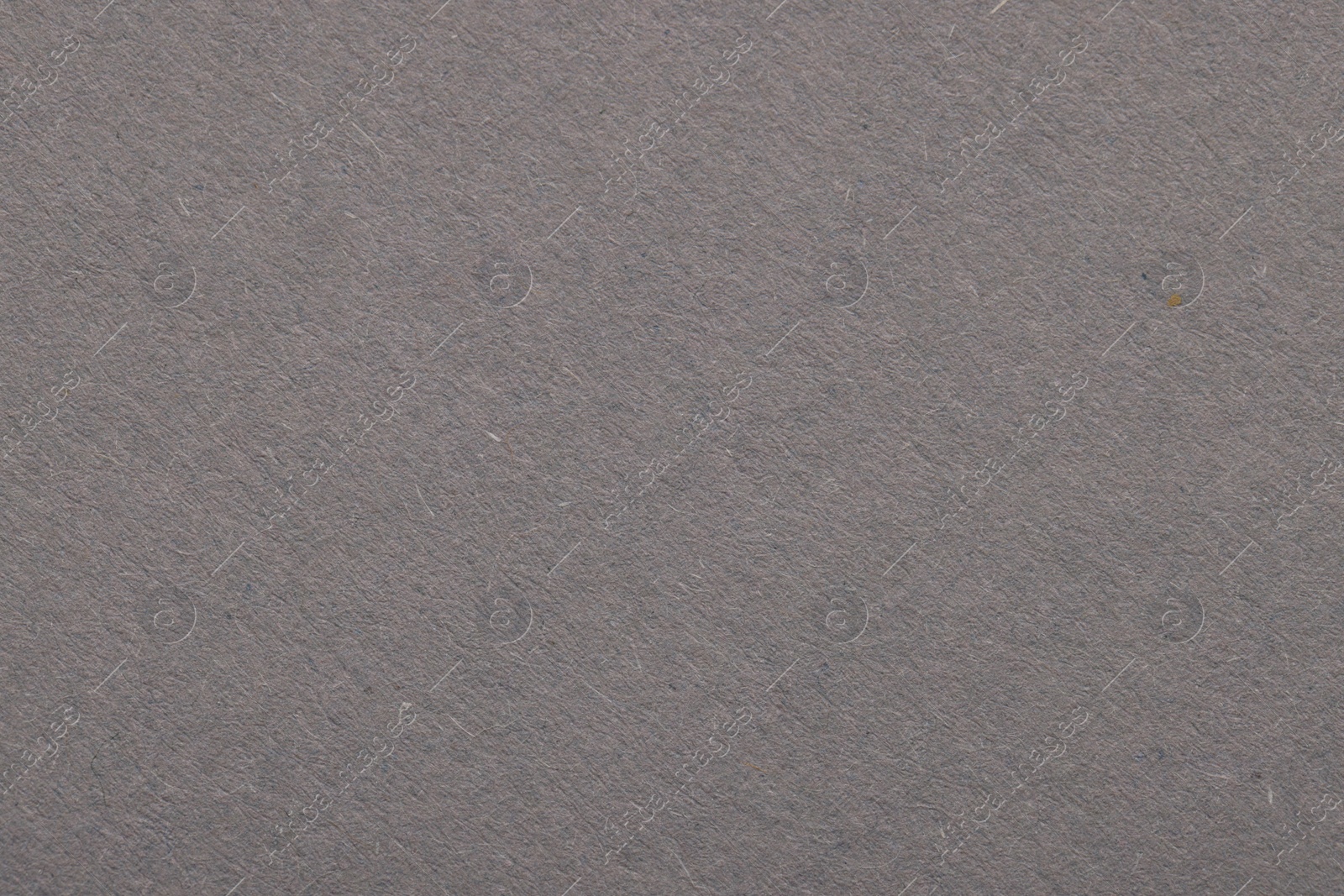 Photo of Texture of grey paper sheet as background, top view