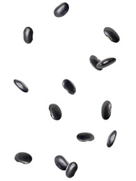 Many black beans falling on white background. Vegan diet 