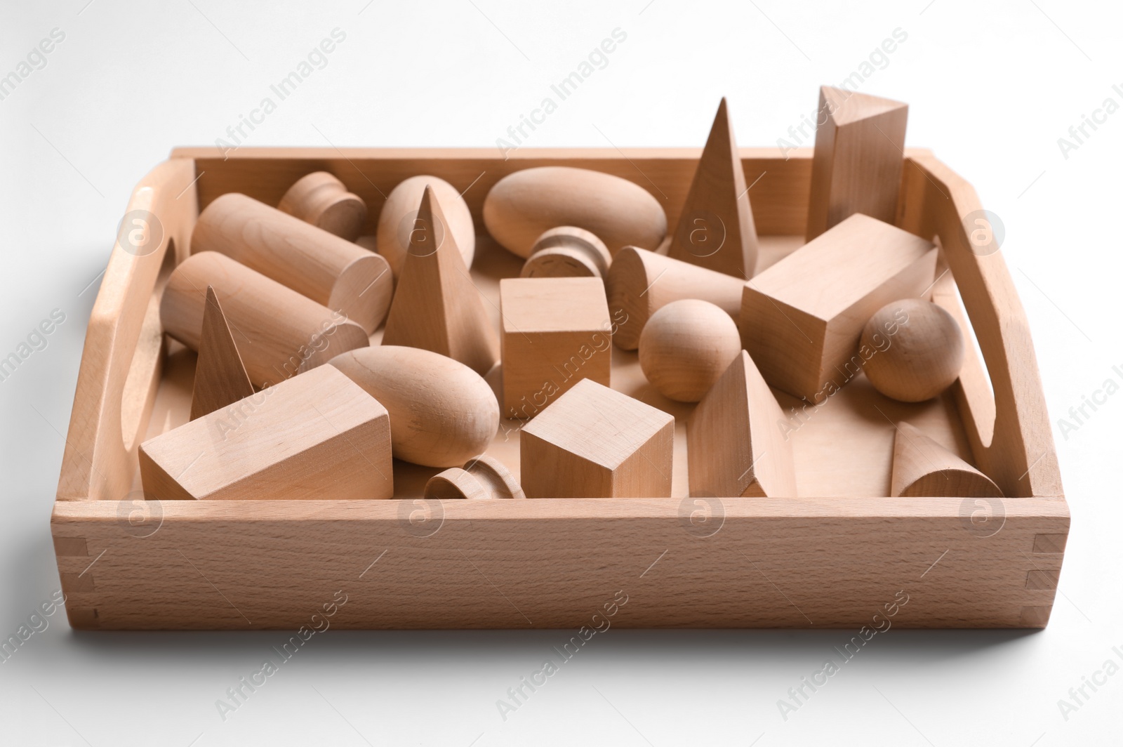 Photo of Set of wooden geometrical objects in box isolated on white. Montessori toy