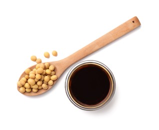 Photo of Bowl of soy sauce and spoon with soybeans isolated on white, top view