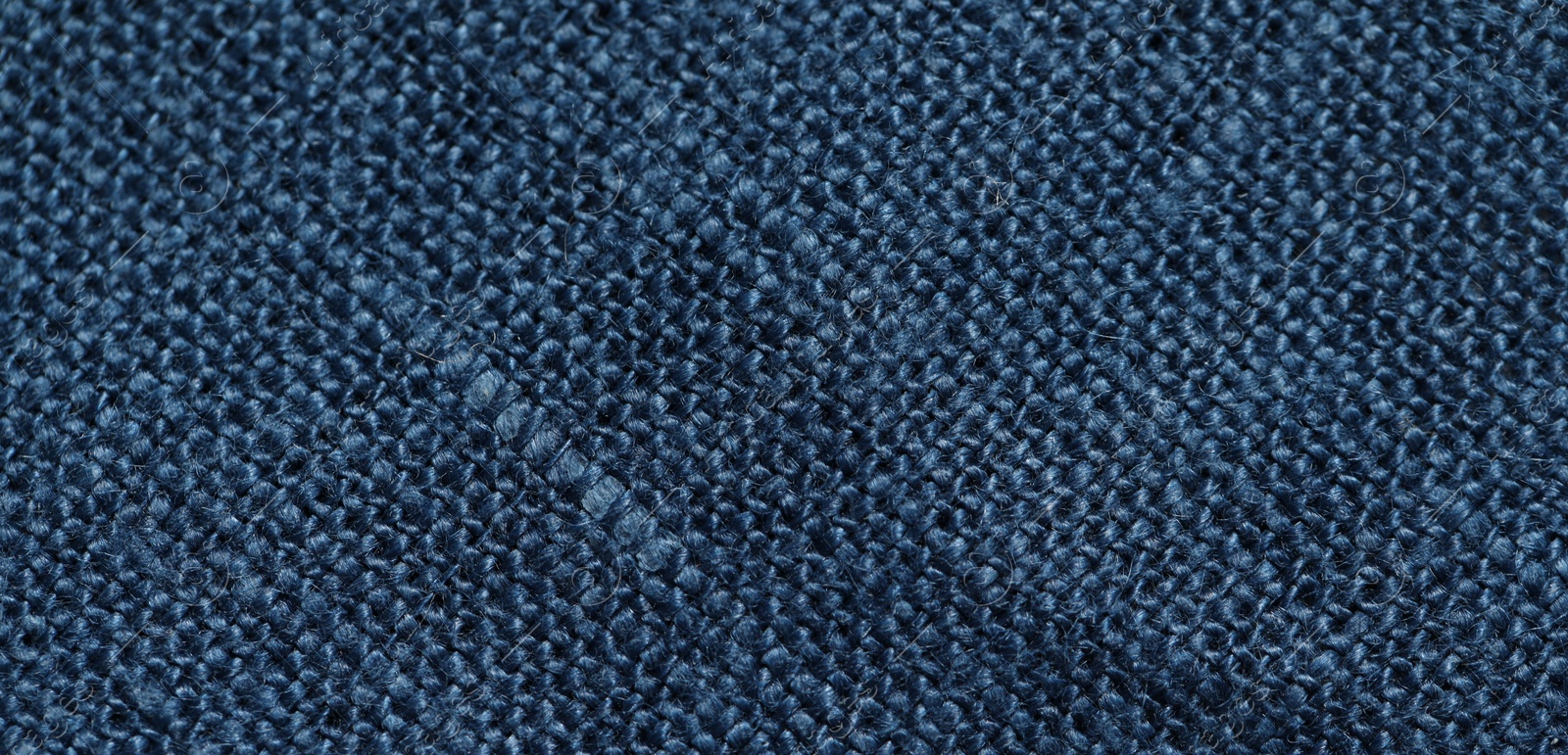 Photo of Texture of blue fabric as background, top view