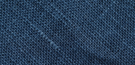 Photo of Texture of blue fabric as background, top view