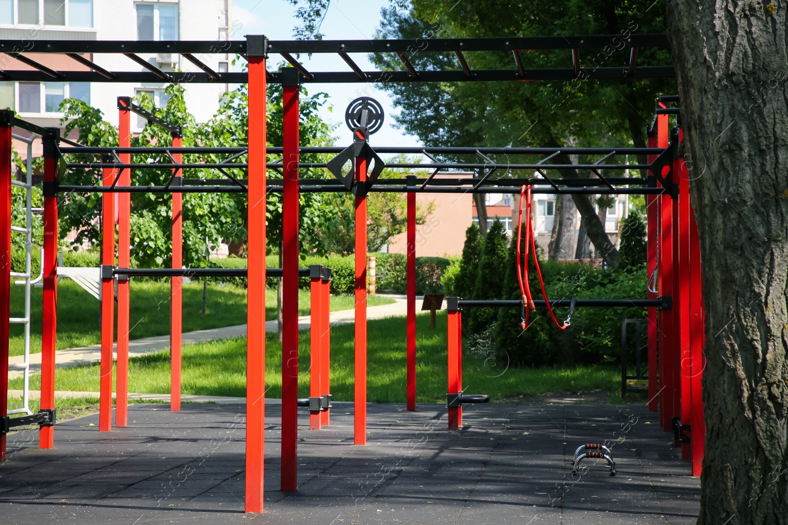 Photo of Empty outdoor gym with exercise equipment in park